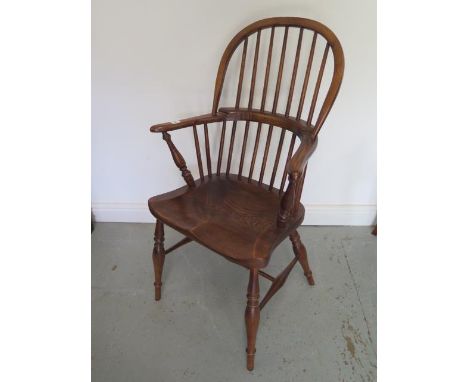 An ash and elm 19th century style Windsor stick back elbow chair, 101cm tall 