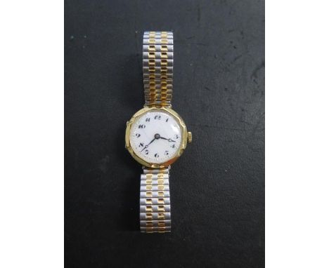 An 18ct yellow gold ladies manual wind wristwatch, 25mm case on a sprung strap, total weight approx 28.8 grams, running, some