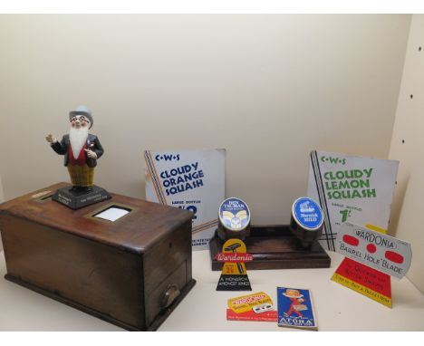 A vintage wooden shop till and assorted card shop advertising and pub advertising 
