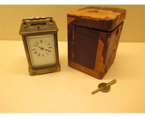 A Victorian brass presentation carriage clock with repeat striking on a gong, 12cm tall with handle down, with travel case, c
