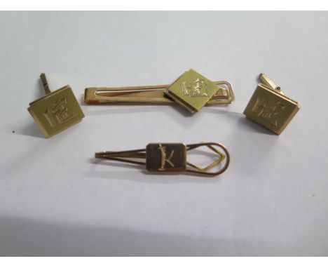 A pair of 14ct yellow gold engraved cufflinks and matching tie clip, approx 16.2 grams and another tie clip, engraved, tests 