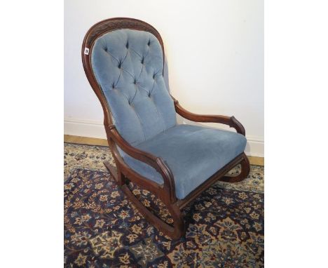 A Victorian mahogany button back rocking chair, 98cm tall 