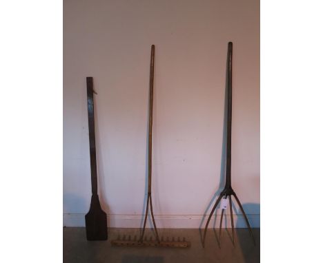 Three antique and vintage tools, two rakes and a bakers peel - in polished condition 