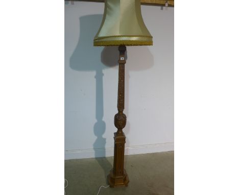 A good quality carved light oak 1930s standard lamp with shade, wired for use, 206cm tall with shade 