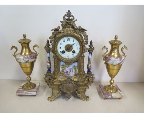 An Ormulu and Porcelain mantle clock - 35cm tall, and a pair of associated garnitures, clock not working 