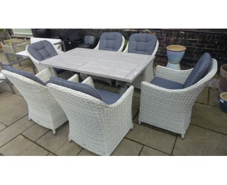 Six Bramblecrest Monterey armchairs and a Monterey 155cm rectangle ceramic table 