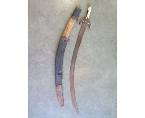 A 19th century Karabela curved sword with bone grip and gilt inlay to blade, total length 90cm, pitting and general wear to b