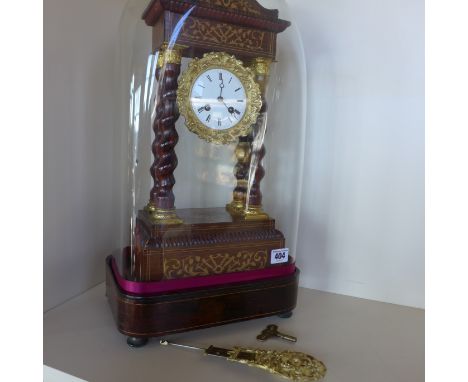 A 19th century walnut and marquetry Portico clock under a glass dome, in good condition with a key and pendulum - in working 