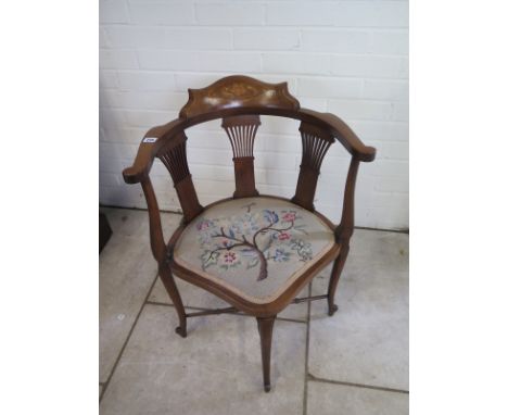 An Edwardian inlaid mahogany corner chair with tapestry seat, tapered legs and stretchers 