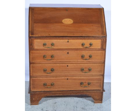 An Edwardian mahogany fall front bureau, satinwood shell inlay to flap, four long graduated drawers with crossbanding and met