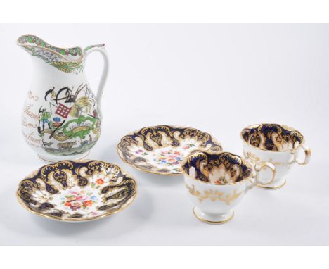 Derby style cup and saucer, painted with floral sprays in a cobalt and gilt ground, saucer 14.5cm; another very similar cup a