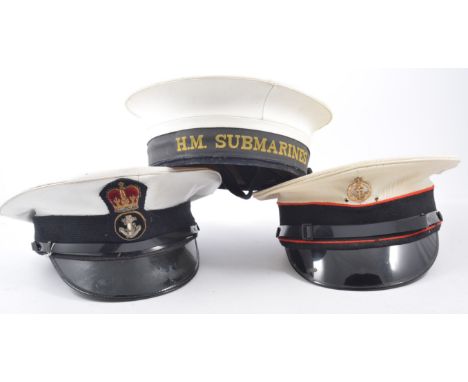 A naval peaked cap, with anchor button badge labelled Golding, London, HM Submarines hat, and other peaked caps.