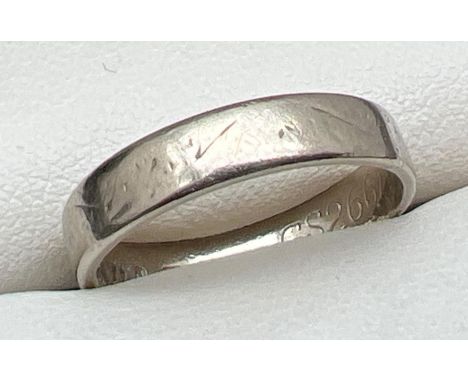 A vintage 18ct white gold wedding band with worn pattern to outside rim. Full hallmarks to inside of band. Size N, total weig