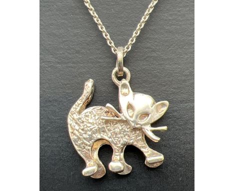 A vintage silver cat pendant in plain and hammered effect silver, on a 15 inch belcher chain. Pendant marked Birmingham 1978.