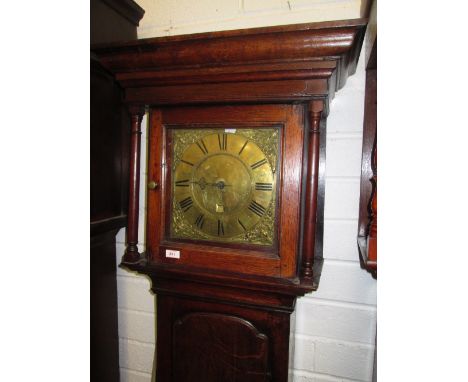 A late 18th century oak longcase clock having square pillar hood containing brass dial and 30 hour movement by Sam Parrat on 