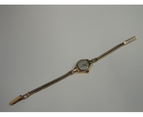 A ladies 9ct gold wrist watch by Roamer having Arabic numerals to dial on a double row snake chain wrist strap