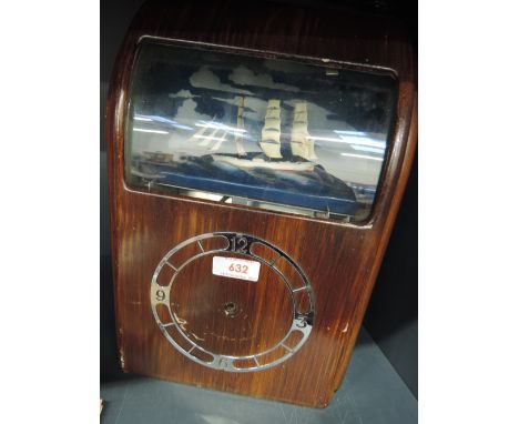 A mid 20th century electro mechanical vitascope mantel clock having moveable seascape