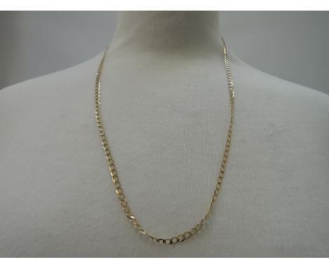 A yellow metal flat curb chain stamped 9K,  approx 5.5g & 24'
