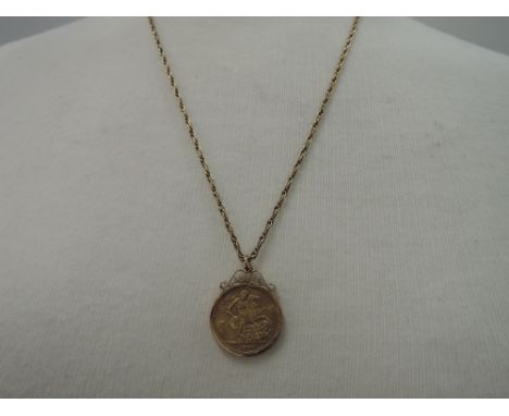 A gold sovereign, 1967 in a yellow metal mount on a 9ct gold open rope chain