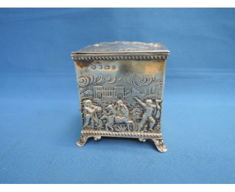 A silver tea caddy of rectangular form having extensive Grecian dancing musician repousse decoration, Birmingham 1904, Thomas