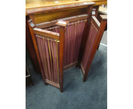 A late Victorian oak frame triptyct firescreen in the Art Nouveau style having curtain panels