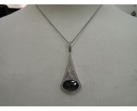 An 18ct white gold tear drop Crystal Haze pendant by Stephen Webster having hematite facetted stone within pierced setting se