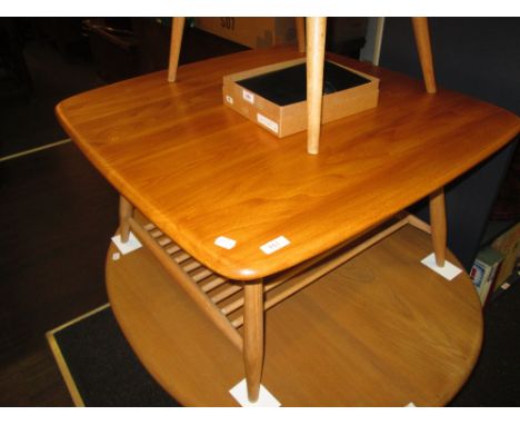 A 1907's light elm Ercol coffee table having re-stained square top and grid undertier