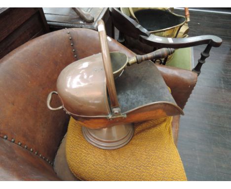 An early 20th Century copper coal helmet