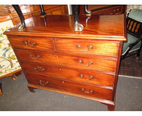 An early 19th century mahogany chest of two short and three long cockbeaded drawers on bracket feet