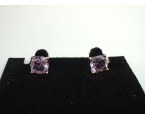 A pair of amethyst style stud earrings in yellow metal mounts stamped 10K