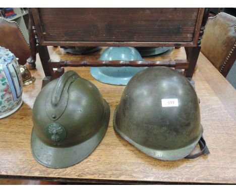 An early-mid 20th century military Grenadiers helmet, and a mid 20th century Russian style military helmet