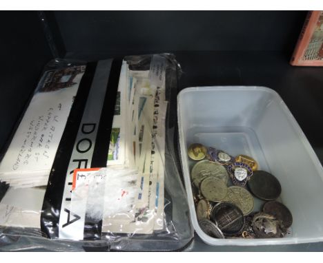 A selection of First Day Covers and a box of badges and medallions, various