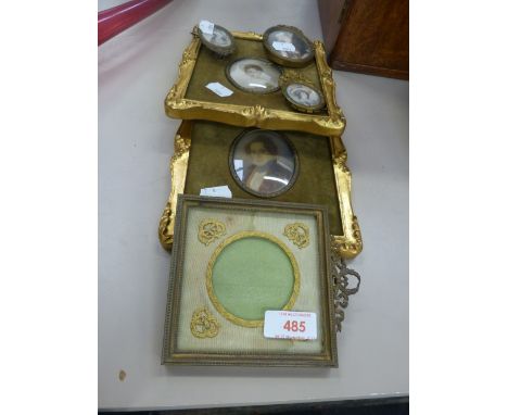 A pair of early 20th century gilt effect frame oval miniature portrait studies and three smaller oval studies and a frame