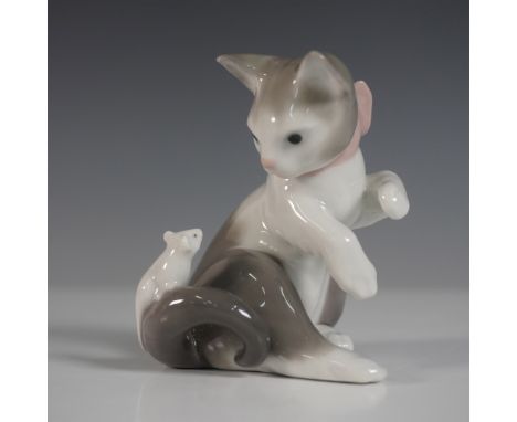 A charming Lladro porcelain figurine titled Cat and Mouse, model number 01005236. Designed with intricate detail, this deligh