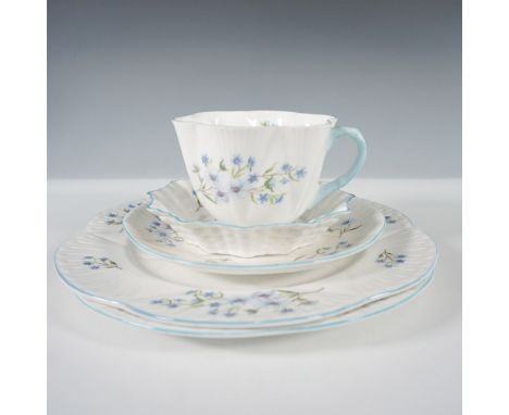 A five-piece Shelley bone china tea set in the "Blue Rock" pattern, featuring delicate blue flowers with green foliage. This 