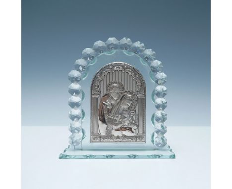 This elegant religious icon features a silver-plated relief depiction of the Holy Family, meticulously mounted on a beveled g