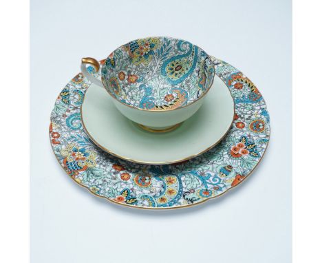 A three-piece Shelley fine bone china tea set featuring a green paisley chintz pattern. The set includes a teacup, saucer, an