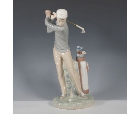 This collectible Lladro porcelain figurine titled "Golfer" (model #4824), showcases the refined elegance and delicate modelin
