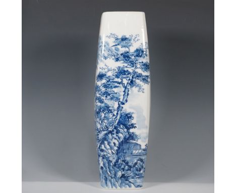 A finely crafted Chinese blue and white porcelain vase featuring an elongated, rectangular form with a gently tapered top. Th