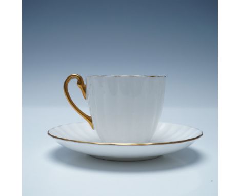 A refined Shelley fine bone china demitasse cup and saucer set, featuring an elegant fluted design with a pristine white fini