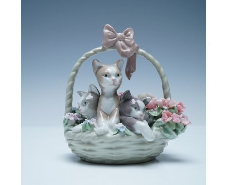 A charming Lladro porcelain figurine titled Purr-fect (01001444), depicting a beautifully sculpted basket filled with three p