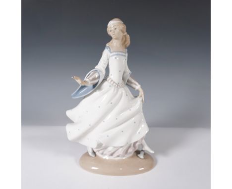 A sculpted Lladro porcelain figurine. This glossy porcelain piece captures Cinderella mid-motion, dressed in a flowing gown w