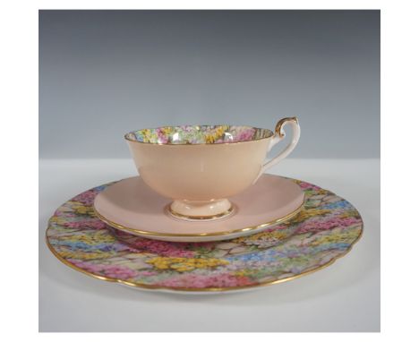 Shelley England Rock Garden trio set, featuring a teacup, saucer, and plate in a delicate pastel pink design. The plate and c