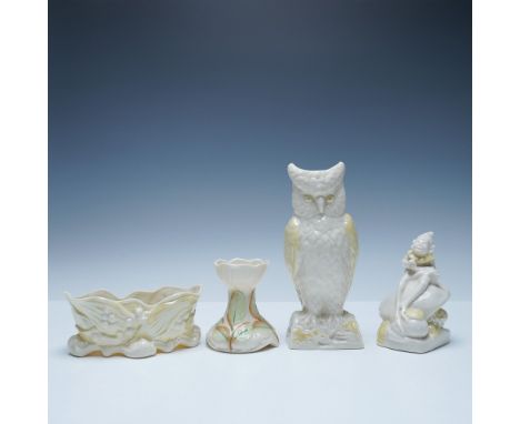 A collection of four Belleek porcelain pieces featuring classic Irish craftsmanship. This set includes a shell-motif planter,