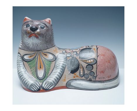 A striking large Tonalá pottery resting cat, handcrafted in Mexico with traditional burnished clay techniques. This folk art 