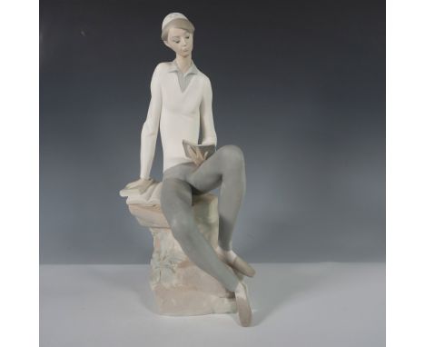Exquisite Lladro porcelain figurine titled Hebrew Student, model number 1014684. This finely crafted piece depicts a young sc