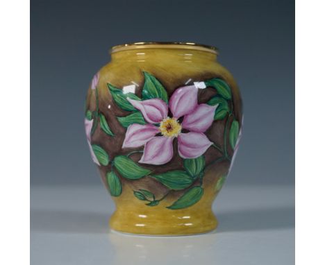 Designed by Fiona Bakewell, this limited edition Moorcroft Enamel vase showcases the exquisite Maltese Clematis design. The c