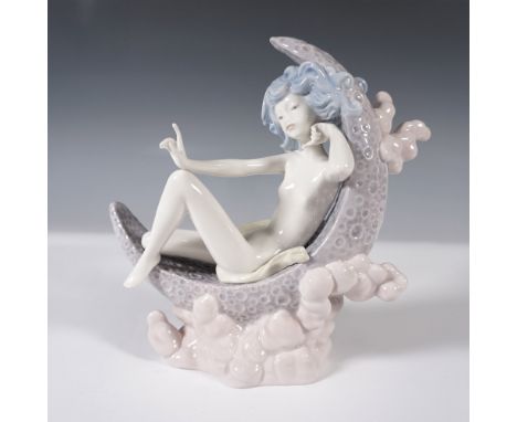 This Lladro porcelain figurine features a gracefully reclining figure with flowing blue hair, delicately posed against an int