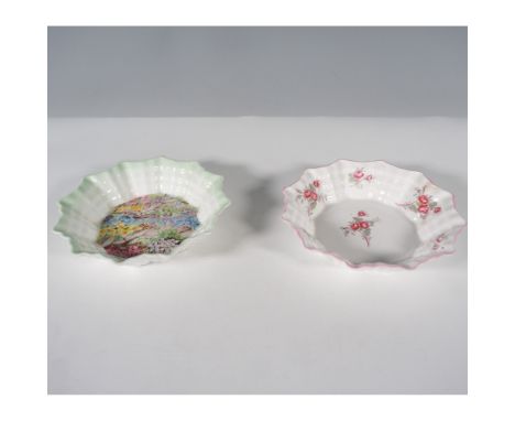 A charming pair of Shelley England porcelain bowls featuring the iconic fluted design. One bowl showcases a delicate floral m
