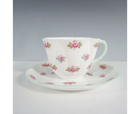 A charming Shelley bone china cup and saucer set in the delicate Rosebud pattern. The cup is crafted in the Oleander shape, f